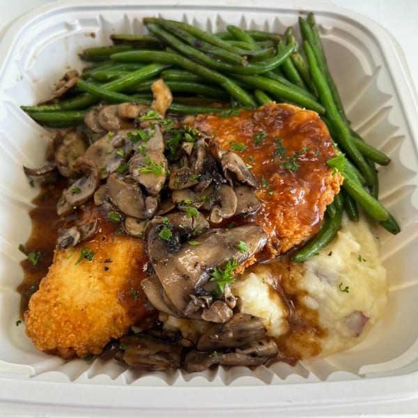 Chefhouse American cuisine: fried chicken with mushroom gravy, mashed potatoes, and green beans.